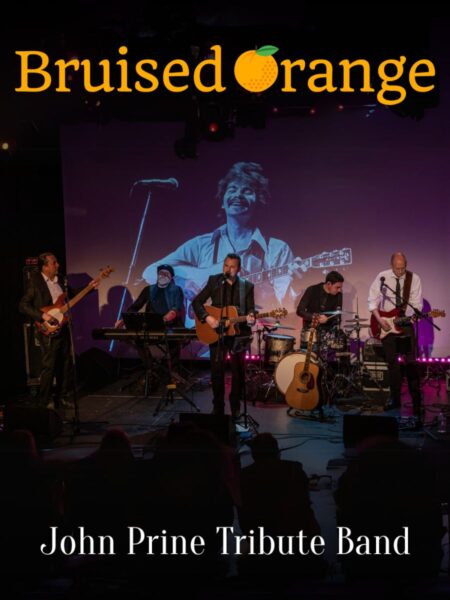 Bruised Orange in performance on a dimly-lit stage