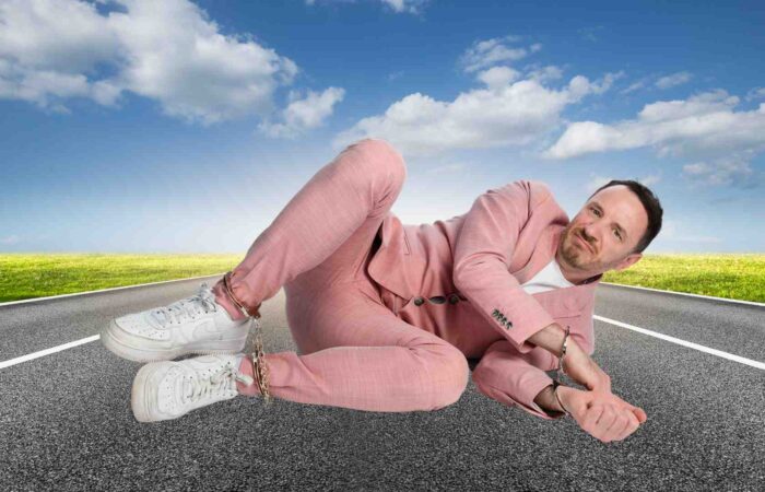 Gearoid Farrelly lying in the middle of a road