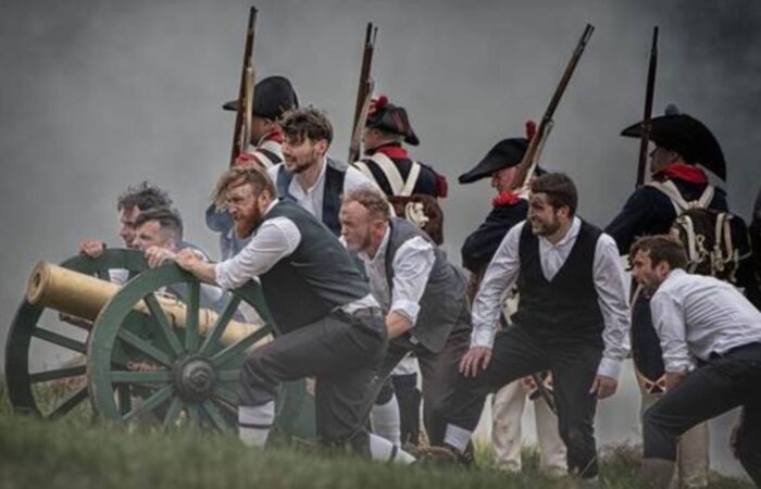 A group of actors in period costume on a battlefield depicting the Battle of Ballinamuck