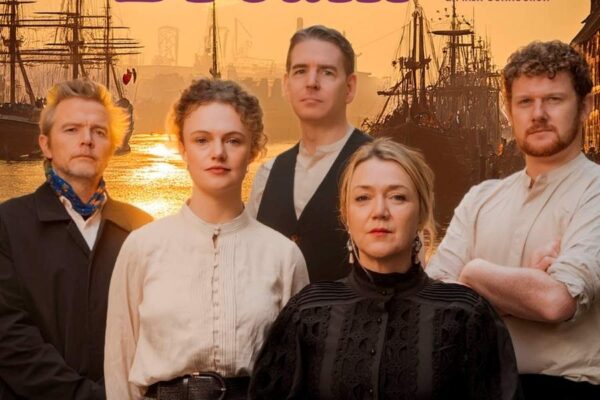 Five people in period clothing stand solemnly in front of a sunset-lit harbor with ships. The text reads "The Sailor's Dream." The mood is dramatic and historical.