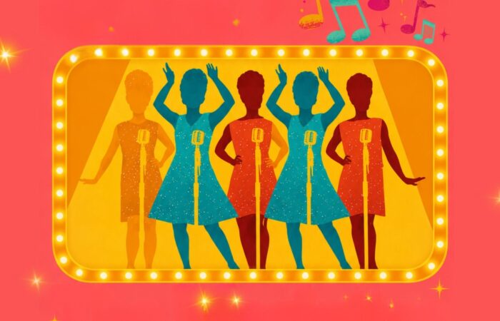 The Mariettas - Colourful retro-style illustration of a female vocal group performing on stage. Five silhouetted singers in bright dresses stand behind vintage microphones inside a glowing marquee frame, with spotlights, musical notes, and sparkling accents against a vibrant pink background. The image evokes the energy and glamour of a classic showband concert.